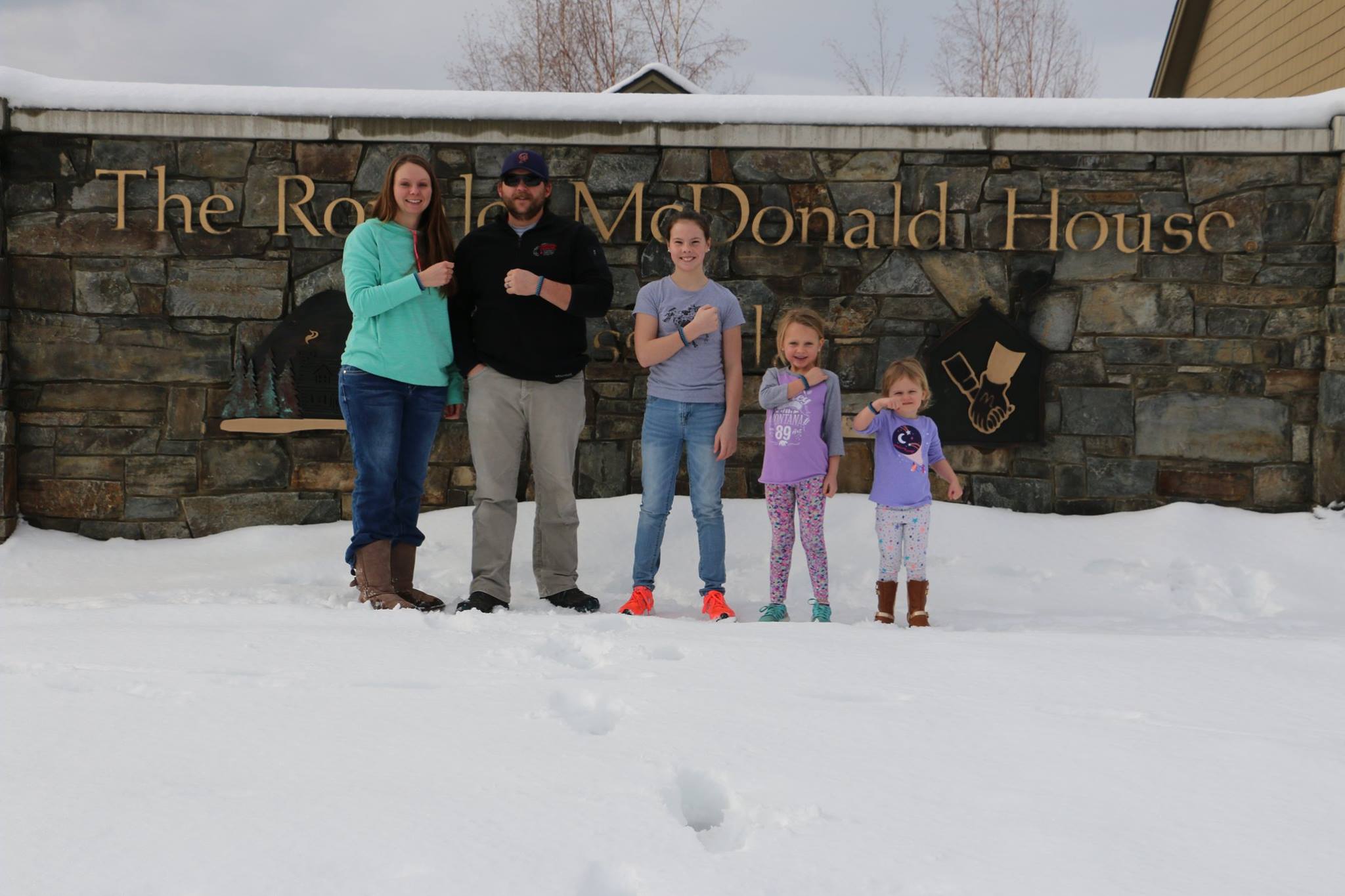 Family standing in snow